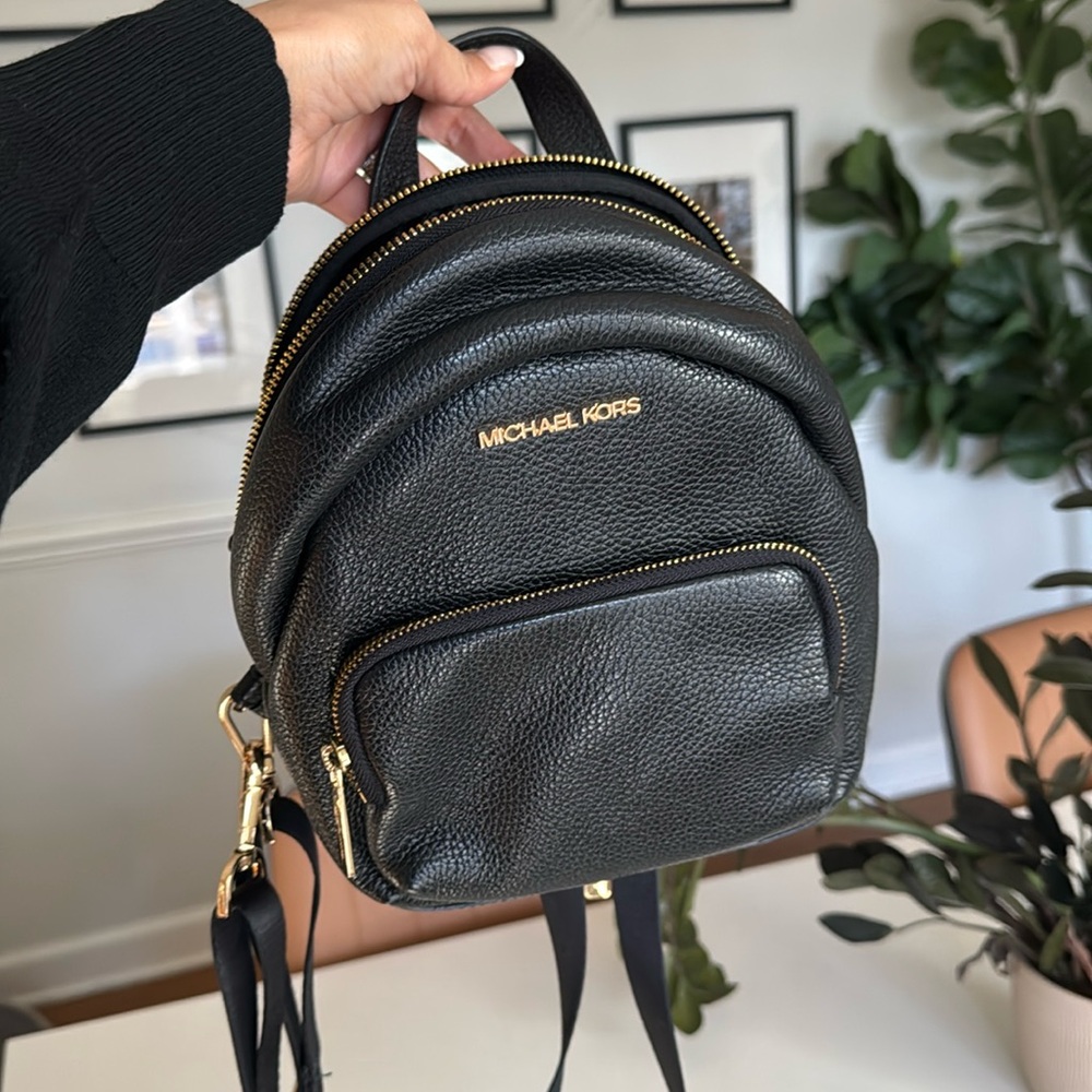 Michael Kors leather backpack or cross body